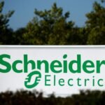 The logo of Schneider Electric is seen outside a company building in Nantes, France, September 20, 2022. REUTERS/Stephane Mahe